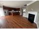 Open floor plan with kitchen, living area, fireplace, and hardwood floors at 258 Coatsville Dr, Westfield, IN 46074