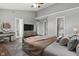 Primary bedroom featuring ceiling fan, TV, ensuite bathroom, and walk-in closet at 258 Coatsville Dr, Westfield, IN 46074