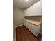 This pantry is designed with white cabinets and a countertop for ample storage and organization at 258 Coatsville Dr, Westfield, IN 46074