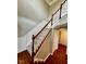 Classic staircase design with white trim, gray walls, and hardwood floors at 258 Coatsville Dr, Westfield, IN 46074