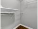 Walk-in closet offering ample storage space with wire shelving and hardwood flooring at 258 Coatsville Dr, Westfield, IN 46074