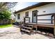 Back of house featuring a deck and steps leading to a concrete patio and a fenced backyard at 270 W Broadway St, Greenwood, IN 46142
