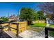 Fenced backyard featuring a lush lawn and mature trees, perfect for outdoor activities and relaxation at 270 W Broadway St, Greenwood, IN 46142