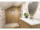 Stylishly renovated bathroom with textured shower and a modern vanity, offering a spa-like experience at 270 W Broadway St, Greenwood, IN 46142
