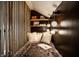 Close up view of a reading nook with lights, shelves, pillows, and books creating a cozy space at 270 W Broadway St, Greenwood, IN 46142