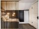 Cozy reading nook with a custom wood screen, plush seating, and stylish lighting near the bedroom at 270 W Broadway St, Greenwood, IN 46142