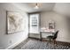 Bright bedroom with a world map, modern desk, and unique geometric rug adding style and functionality at 270 W Broadway St, Greenwood, IN 46142