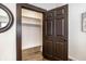 Open closet shows shelving and hanging rods with a view into a well organized, spacious closet at 270 W Broadway St, Greenwood, IN 46142