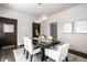 Bright dining room features dark wood table, modern chandelier, and neutral decor with plenty of natural light at 270 W Broadway St, Greenwood, IN 46142