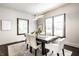 Cozy dining room with modern table and chairs, complemented by a stylish chandelier at 270 W Broadway St, Greenwood, IN 46142