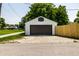 A garage in the backyard with a basketball hoop on the front of it at 270 W Broadway St, Greenwood, IN 46142