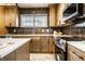 Well-lit kitchen featuring modern appliances, bright countertops, and ample cabinet space at 270 W Broadway St, Greenwood, IN 46142