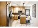 Charming kitchen features marble floors, stainless steel appliances, and an inviting island seating area at 270 W Broadway St, Greenwood, IN 46142