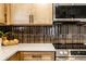 Stylish kitchen with stainless steel appliances, modern backsplash, and ample countertop space at 270 W Broadway St, Greenwood, IN 46142