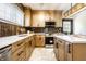 Beautiful kitchen with stainless steel appliances, stone countertops and abundant natural light at 270 W Broadway St, Greenwood, IN 46142
