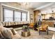 Open-concept living room featuring large windows and a view into the kitchen at 270 W Broadway St, Greenwood, IN 46142