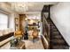 Bright living area with hardwood stairs and modern chandelier at 270 W Broadway St, Greenwood, IN 46142