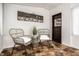 Cozy sunroom featuring wicker chairs, unique floors, and decorative touches, creating a relaxing retreat at 270 W Broadway St, Greenwood, IN 46142
