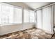 Bright sunroom with lots of windows and hexagonal tile flooring creating a cozy, light-filled space at 270 W Broadway St, Greenwood, IN 46142