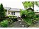View of a spacious backyard with a wooden deck and mature trees at 2805 Rylee Ct, Greenwood, IN 46143