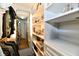 Open closet with white shelving. There is a mirror inside of the closet and clothing is hung up inside of it at 2805 Rylee Ct, Greenwood, IN 46143