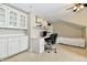Functional office space with built-in cabinets, desk, and a cozy area for work or study at 2805 Rylee Ct, Greenwood, IN 46143