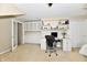 Spacious home office with built-in desk, cabinets, and ample storage, plus a bed for relaxation at 2805 Rylee Ct, Greenwood, IN 46143