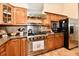 Well-lit kitchen featuring stainless appliances, wooden cabinets, and modern fixtures at 2805 Rylee Ct, Greenwood, IN 46143