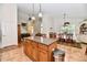 Open concept kitchen with a central island, stainless steel appliances, and an adjacent dining area at 2805 Rylee Ct, Greenwood, IN 46143