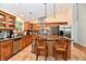 Updated kitchen featuring stainless steel appliances, wood cabinets, and island seating at 2805 Rylee Ct, Greenwood, IN 46143