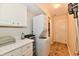 Bright laundry room with front-load washer and dryer, storage cabinets, and a countertop at 2805 Rylee Ct, Greenwood, IN 46143