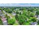 Neighborhood view with lush trees and well-maintained homes, showcasing a peaceful residential area at 2832 Hillside Ave, Indianapolis, IN 46218