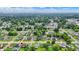 A wide aerial view of a residential community with lush greenery and diverse homes at 2832 Hillside Ave, Indianapolis, IN 46218