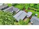 An aerial shot of a backyard featuring a spacious lawn and a detached garage at 2832 Hillside Ave, Indianapolis, IN 46218