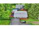Aerial view of backyards, revealing manicured lawns, patios, and lush landscaping at 2832 Hillside Ave, Indianapolis, IN 46218