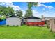 Lush backyard featuring ample green space, patio with seating, and well-maintained landscaping at 2832 Hillside Ave, Indianapolis, IN 46218