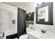 Modern bathroom featuring white marble tiling, sleek fixtures, and a stylish vanity at 2832 Hillside Ave, Indianapolis, IN 46218