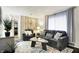Cozy living room featuring a comfortable sofa, modern decor, and warm lighting at 2832 Hillside Ave, Indianapolis, IN 46218