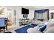 Living room featuring comfortable seating, stylish decor, and a view into an adjacent kitchen at 2832 Hillside Ave, Indianapolis, IN 46218
