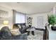 Inviting living room with stylish furniture, neutral decor, and lots of natural light at 2832 Hillside Ave, Indianapolis, IN 46218
