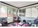 Relaxing enclosed porch offering a comfortable space to enjoy the outdoors at 2832 Hillside Ave, Indianapolis, IN 46218