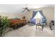 Spacious bedroom with a ceiling fan, large window, and ample natural light at 2925 Horse Hill East Dr, Indianapolis, IN 46214