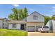 Charming house with stone accents, an attached garage, and a well-maintained lawn at 2925 Horse Hill East Dr, Indianapolis, IN 46214