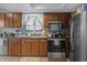 Traditional kitchen with wooden cabinets, stainless steel appliances, and a stainless-steel sink at 2925 Horse Hill East Dr, Indianapolis, IN 46214