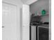 Convenient laundry room featuring modern appliances and storage shelves for supplies at 2925 Horse Hill East Dr, Indianapolis, IN 46214