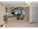The open concept living room with gray walls and wood beam accents at 2925 Horse Hill East Dr, Indianapolis, IN 46214