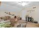 Cozy living room featuring a ceiling fan, decorative shelves, and comfortable seating arrangement at 2925 Horse Hill East Dr, Indianapolis, IN 46214