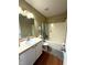 Bathroom with vanity, mirror, and a shower-tub combo with a curtain at 3065 Hemlock Way, Indianapolis, IN 46203