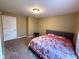 Bedroom featuring carpet, a queen sized bed, and bright natural light from the window at 3065 Hemlock Way, Indianapolis, IN 46203
