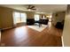 Spacious living room with hardwood floors and multiple sofas, flowing into the kitchen at 3065 Hemlock Way, Indianapolis, IN 46203